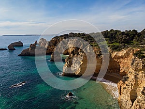 Panorama view of Praia do Submarino Algarve cliff coast sand beach holiday vacation spot in Portimao Portugal Europe