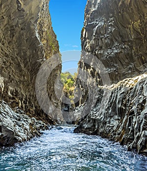 A panorama view of the river rapids and basalt column walls in the Alcantara gorge near Taormina, Sicily