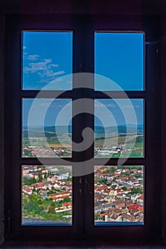 Panorama view of Romanian town Rupea thorugh window of the citad