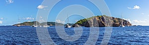 A panorama view sailboats moored of the Pelican Island and the Indian Islets off the main island of Tortola