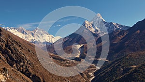 Panorama view of Sherpa village Pangboche in valley below snow-capped mountain Ama Dablam and Mount Everest massif. photo