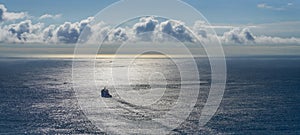 panorama view of a ship heading out to sea