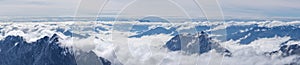 Panorama view of snow mountain range in summer from Top of Germany Zugspitze