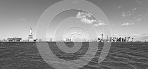 Panorama View of Statue of Liberty at New York City with Manhattan Skyline over Hudson River - USA