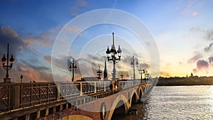 Panorama view in sunset sky scene of the Pont de pierre at sunset and winery region Bordeaux, France