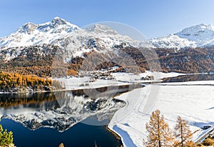 Panorama view of the Swiss Alps town Silvaplana with snow mountain Corvatsch at the background photo