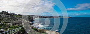 Panorama view of Sydney Bronti Beach NSW Australia. White Sandy Beach, turquoise blue water and surfing waves
