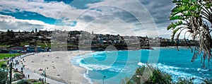 Panorama view of Sydney Bronti Beach NSW Australia. White Sandy Beach, turquoise blue water and surfing waves