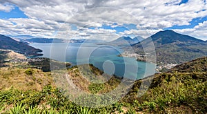 Panorama view to the lake Atitlan with volcanos - small villages San Pedro, San Marcos, San Juan and Panajachel at lake Atitlan in