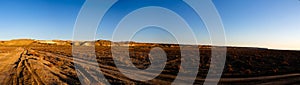 Panorama view to Plateau Ustyurt from the edge of Aral sea near Aktumsuk cape at sunrise, Karakalpakstan, Uzbekistan