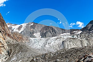 Panorama view of Tre-la-Tete glacier in French Alps, near the Domes-de-Miage towards Mont Blanc, on summer sunny day, blue sky photo