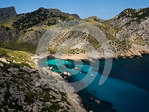 Panorama view of turquoise bright blue water tropical beach bay cove Cala Figuera Formentor Mallorca Majorca Spain