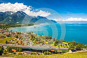 Panorama view of Villeneuve city with Swiss Alps, lake Geneva and vineyard on Lavaux region, Canton Vaud, Switzerland, Europe photo