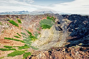 Panorama view into volcano Eldborg crater on iceland photo