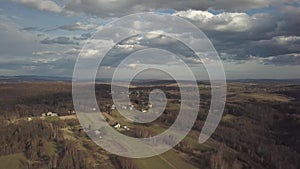 Panorama of the village near the city of Jaslo in Poland with a bird`s-eye view. Stormy sky with clouds. Aerial photography of lan