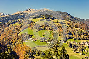 Panorama of the village of VÃÂ¤ttis and bridge against the background of the Swiss Alps at sunset