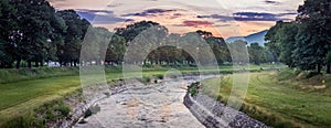 Panorama of a vivid sunset over Nisava river in Pirot, Serbia