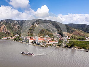 Panorama of Wachau valley (Unesco) with ship on Danube river against Duernstein village in Lower Austria,