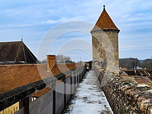 Panorama of walls with snow on Blandy-les-Tours castle towers