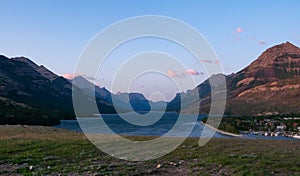 Panorama of Waterton Lake, the Town of Waterton, and Canadian Rockies at Sunrise