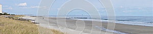 Panorama winter grasses on unpopulated beach with ocean