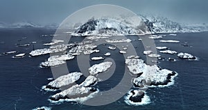 Panorama winter landscape of nordic fjords Lofoten Islands, Norway, seascape and Henningsvaer stadion covered in snow