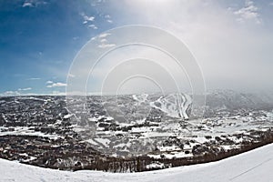 Panorama of winter mountain with ski routes