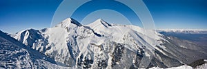 Panorama of winter mountains in Bansko, Bulgaria photo