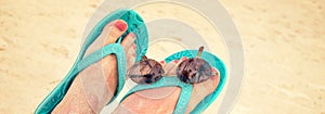 Panorama of woman sandy bare feet with flip flops and sunglasses, vintage style