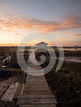 Panorama of wooden pier on stilts boat dock wharf port harbour Cais Palafitico da Carrasqueira Setubal Alentejo Portugal