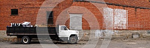 Panorama of Work Truck and Brick Wall