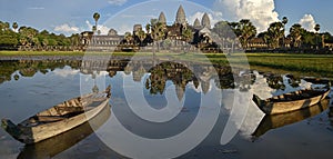 Panoramas of Angkor Wat reflection in lotus pond with two boat on evening, Siem Reap, Cambodia