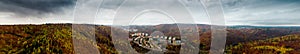 Panoramatic Highres aerial drone view on city Adamov surrounded by colorful autumn forest