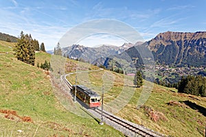 Panoramatic view of Jungfrau Region with incoming train from Gruetschalp GrÃÂ¼tschalp near Winteregg photo