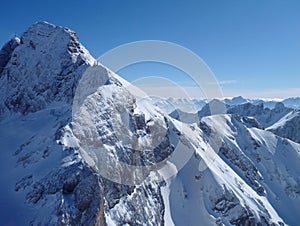 Panoramatic view of snow covered high mountains