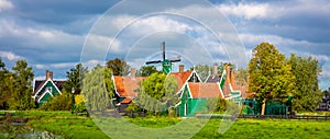 Panoramia of the Dutch village Zaanse Schans near Amsterdam. Typical Dutch green houses and windmills