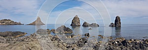 Panoramic Acitrezza view of cyclopean rocks from coastline, colorful seascape in Sicily