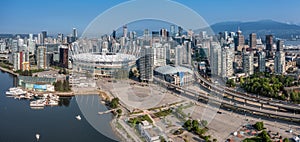 panoramic aerial city view of famous False Creek in Vancouver downtown with Cambie Bridge and BC Place Stadium