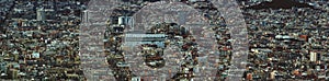 Panoramic aerial cityscape view of the barcelona cityscape showing densely crowded buildings towers and streets