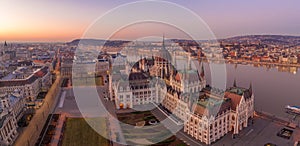 Panoramic aerial drone shot of Dome of Hungarian Parliament at dawn before sunrise in Budapest morning