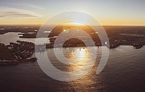 Panoramic aerial drone sunset view of Manly Beach, an affluent seaside suburb of Sydney, New South Wales, Australia.