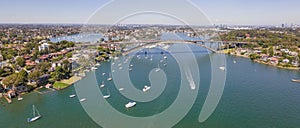 Panoramic aerial drone view of Gladesville Bridge over Parramatta River between Drummoyne, Sydney, Australia