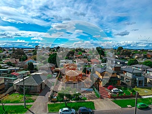 Panoramic Aerial Drone view of Suburban Melbourne housing, roof tops, the streets and the parks NSW Australia