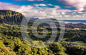 Panoramic aerial image from the Pali Lookout on the island of Oahu in Hawaii. With a bright green rainforest, vertical cliffs and