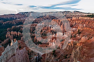 Panoramic aerial morning sunrise view on sandstone rock formations on Navajo Rim hiking trail in Bryce Canyon, Utah, USA