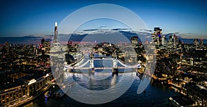 Panoramic aerial night view of the famous Tower Bridge and river Thames