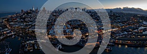 panoramic aerial night view of greater San Francisco area with illuminated skyline