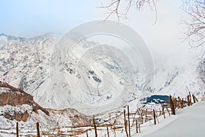 Panoramic aerial top view to winter Caucasian mountains covered