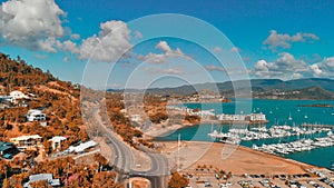 Panoramic aerial view of Airlie Beach skyline and Marina, Australia