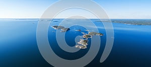 Panoramic aerial view of beautiful islands with green trees and rocks on the baltic sea photo
